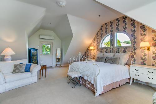 a bedroom with a large bed and a window at Winchester Inn in Ashland