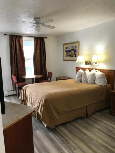 Ένα ή περισσότερα κρεβάτια σε δωμάτιο στο Exit 5 Resort & Condominium