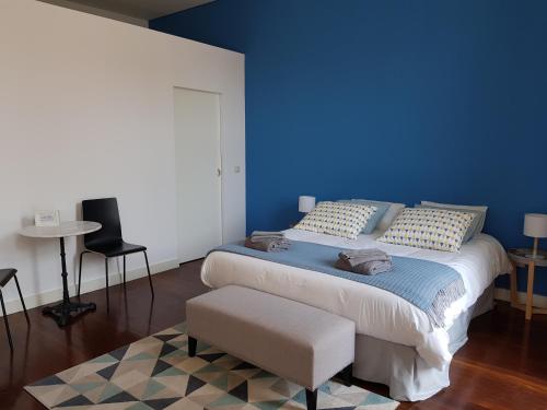 En eller flere senge i et værelse på OHH - Porto Boutique Guest House