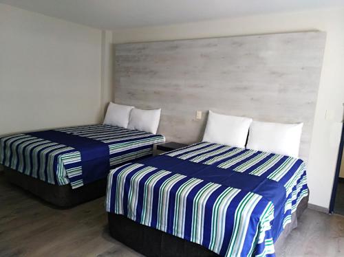 Katil atau katil-katil dalam bilik di Mallorca Hotel 