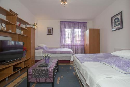 Postel nebo postele na pokoji v ubytování Apartment Marijeta