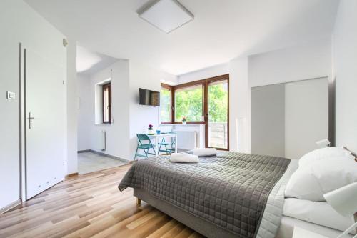 Posteľ alebo postele v izbe v ubytovaní Art Apartments