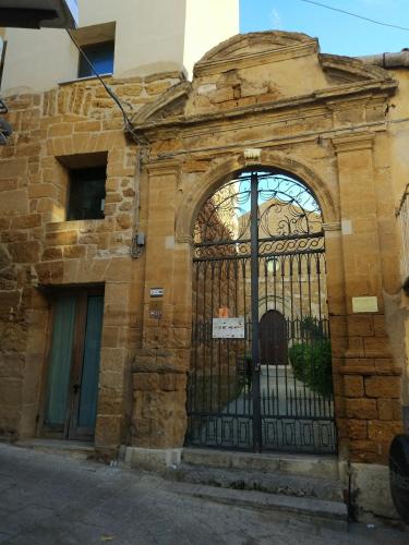 an entrance to a stone building with an iron gate at BnB Sant'Alfonso in Agrigento