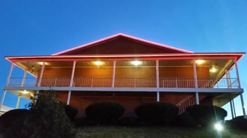 a building with a red roof with lights on it at The Boston Inn in Westminster