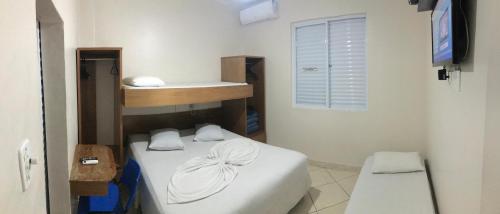 Casarão Hotel tesisinde bir odada yatak veya yataklar