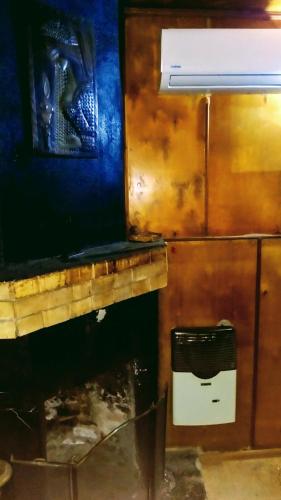 a kitchen with a stove and a refrigerator at Colibri Home in Kutaisi