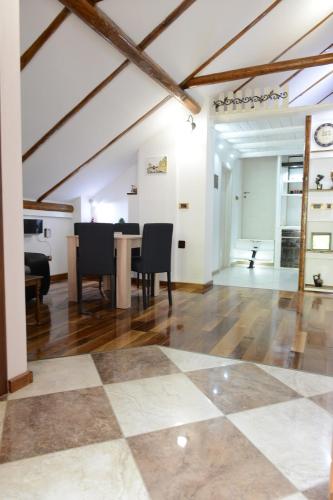 a living room with a checkered floor at Apartman Rustik in Belgrade