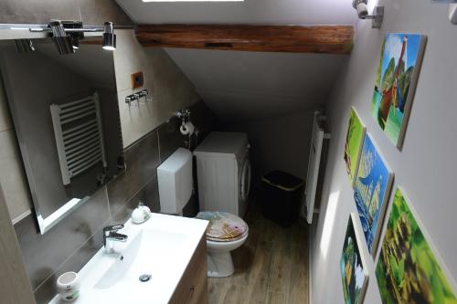 a small bathroom with a toilet and a sink at Apartman Rustik in Belgrade