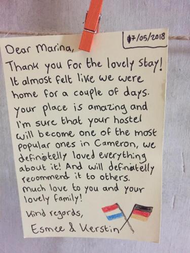 a piece of paper with a handwritten letter at Hikers Sleep Port Guesthouse in Cameron Highlands