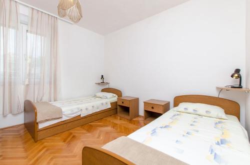 Postel nebo postele na pokoji v ubytování Apartment Danijela