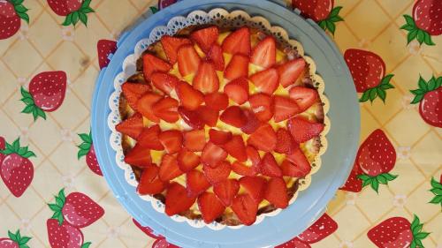 a pie with strawberries on top of a table at San Paterno B&B in Rapolano Terme