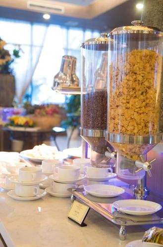 a pile of food in a container on a table at Muong Thanh Luxury Ca Mau Hotel in Cà Mau