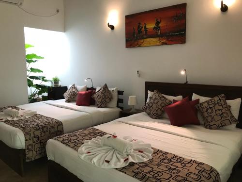 Giường trong phòng chung tại Hotel Heladiv