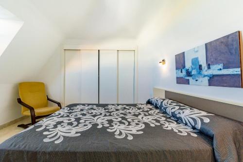 Postel nebo postele na pokoji v ubytování RealRent Mirador al Mar