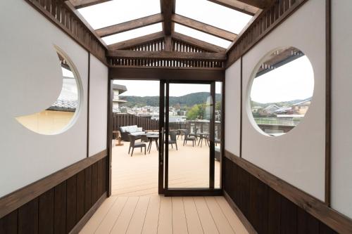 an internal view of a house with two circular windows at Terrace Kiyomizu Kyoto in Kyoto