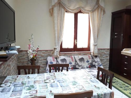 a dining room with a table with money on it at Casa Imma Napoli in Naples