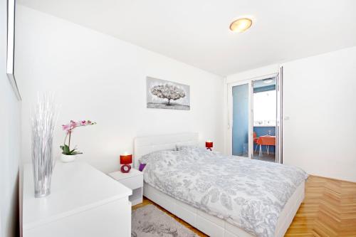 Posteľ alebo postele v izbe v ubytovaní Apartment Joker