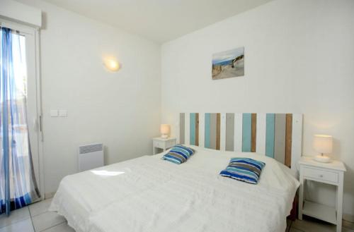 A bed or beds in a room at Residence Plage Oceane