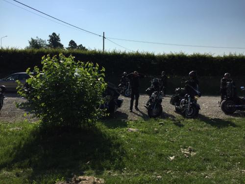 a group of motorcycles parked on a grass field at Fondo Giardinetto in San Cesario sul Panaro