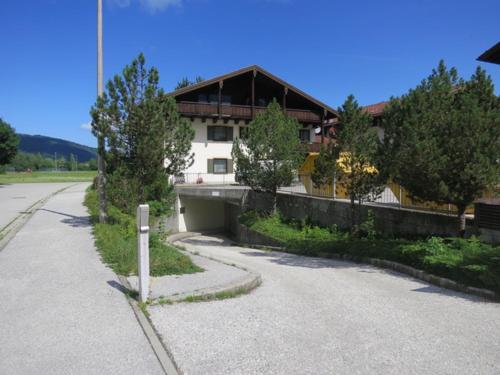 a house on the side of a street with a road at Studio App. 337 mit Blick auf die Berge in Inzell