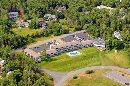 an aerial view of a hotel with a parking lot at Kimball Terrace Inn in Northeast Harbor