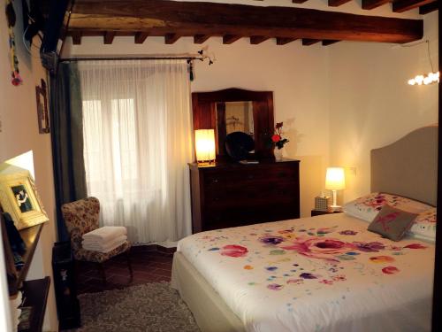 Кровать или кровати в номере Andante appartamenti