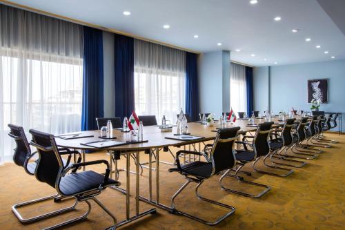 a conference room with a long table and chairs at BURJ ON BAY Hotel in Jounieh