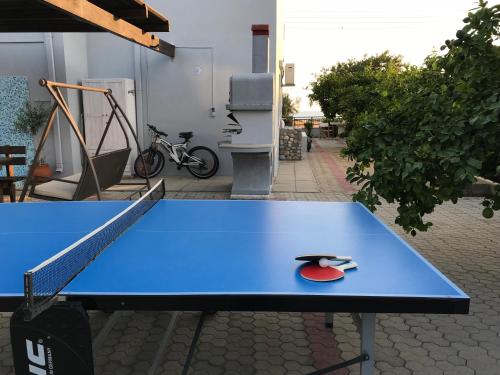 a blue ping pong table with a red ball on it at Villa Amor in Pefki Rhodes