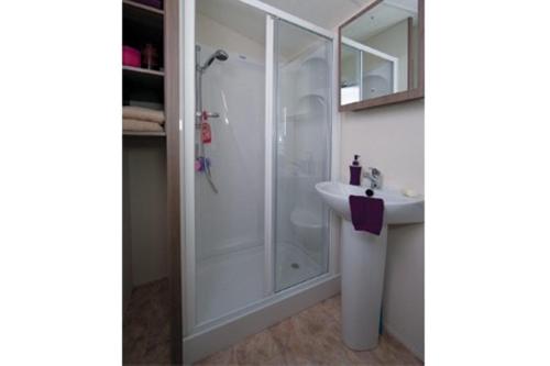 a bathroom with a shower and a sink at Caravans Tattershall Lakes in Tattershall