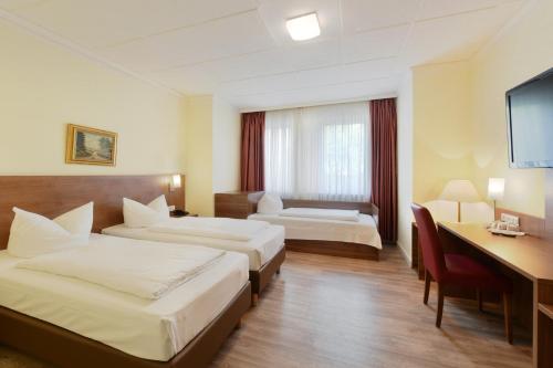 Ένα ή περισσότερα κρεβάτια σε δωμάτιο στο Hotel Schumacher Düsseldorf
