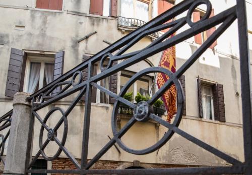 a wrought iron gate in front of a building at Hotel Casa Petrarca in Venice