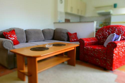 a living room with a couch and a coffee table at Villa AMANI in Sarajevo