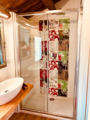 a bathroom with a shower and a white sink at Barbara’s rooms in Chioggia