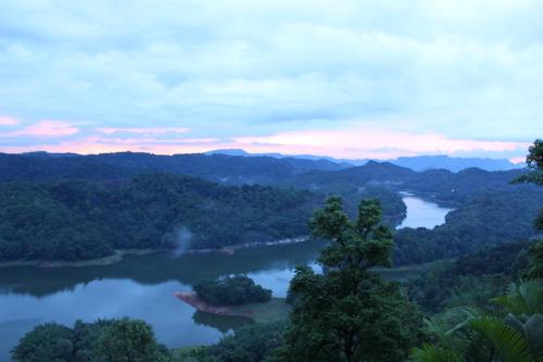 a view of the allegheny river at dusk at Ragamaya Resort & Spa Munnar in Munnar