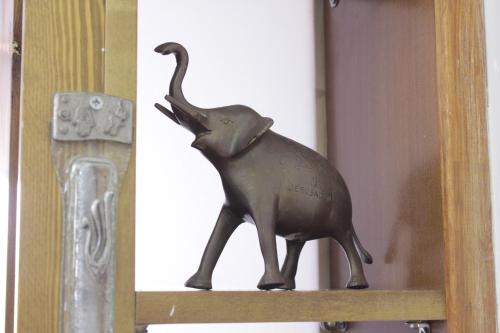 a statue of an elephant sitting on a shelf at Ahuzat Shaul - Apartment in H̱adera