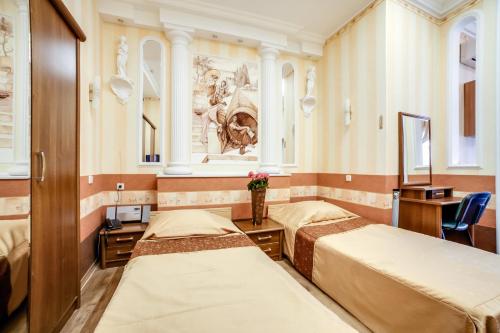 Кровать или кровати в номере Апартаменты Херсонес 
