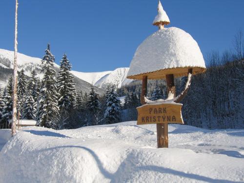 a sign for a park in the snow at Hotel Resort Martin & Kristyna in Špindlerův Mlýn