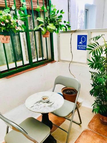 a table and two chairs and a table and a table at H Juan in Marbella