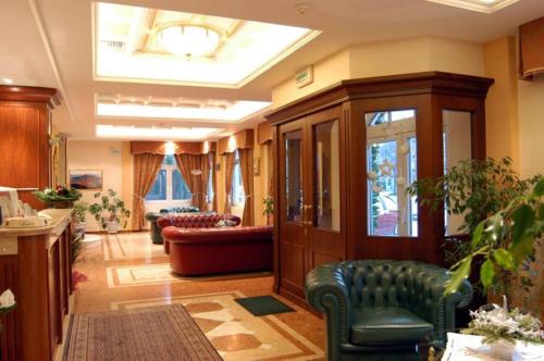 a living room with a couch and a table at Hotel Kastoria in Kastoria City in Kastoria