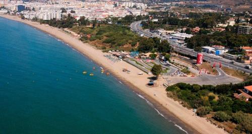 an aerial view of a beach and the ocean at H Juan in Marbella
