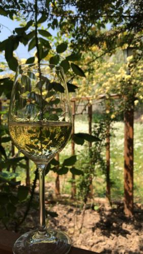 a glass of white wine sitting on a table at Melrose House Hotel in Pamukkale