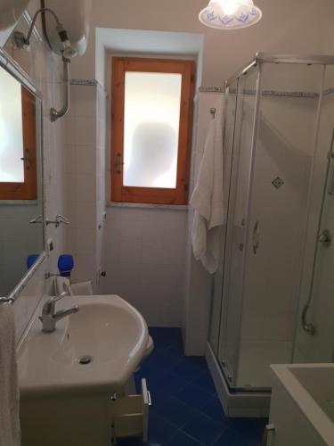 a bathroom with a sink and a shower at Lifra1 in Santa Maria di Castellabate