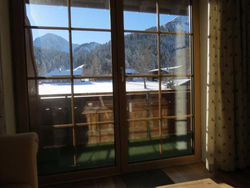 a window with a view of a mountain at Haus Baumgartner in Schattwald