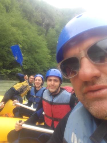 a group of people on a raft on a river at Golubović Apartments in Žabljak