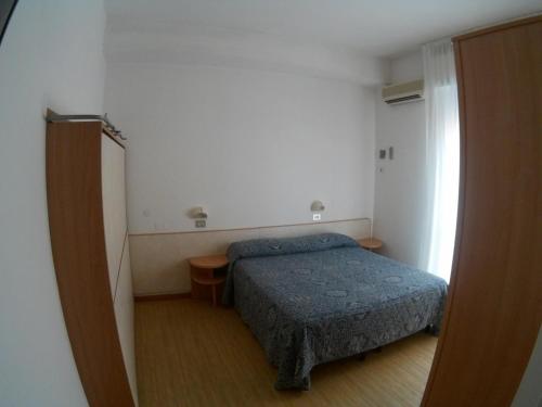 Postel nebo postele na pokoji v ubytování Hotel Azzurro