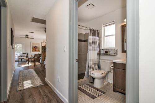 a bathroom with a toilet and a shower at Seaside Cottage B in Clearwater Beach