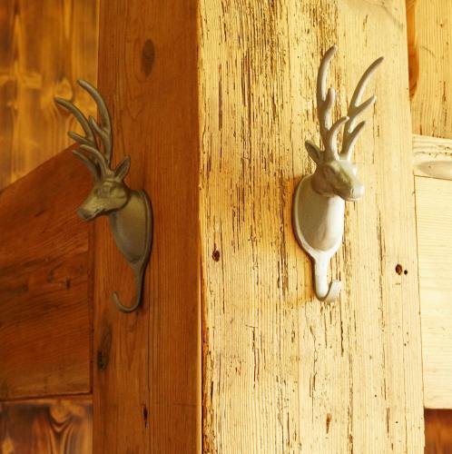 two antlers of a deer on a wooden door at Adventure Hostel Interlaken in Interlaken