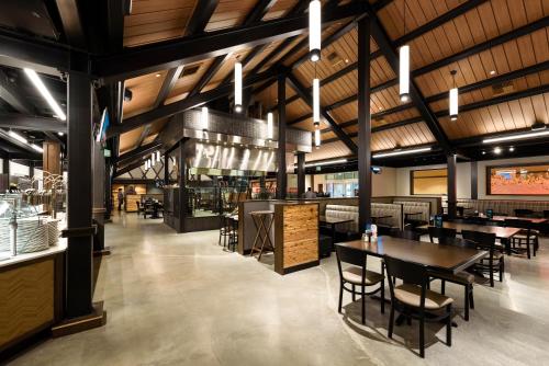 a restaurant with tables and chairs in a room at Lucky Eagle Casino & Hotel (Washington) in Rochester
