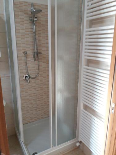 a shower with a glass door in a bathroom at campeggio internazionale del sole in Viverone