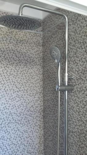 a shower with a glass door in a bathroom at Estudio La Esperanza in La Esperanza